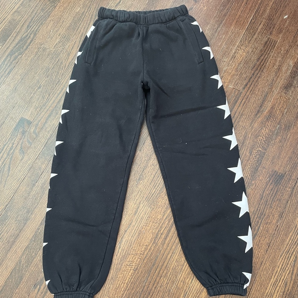 Black Starfit sweatpants with star design on both sides of the legs.
